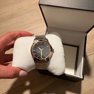 Gucci Men's Black and Gold Watch